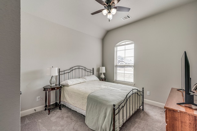 bedroom featuring vaulted ceiling, carpet floors, visible vents, and baseboards