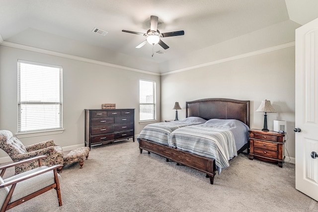 bedroom featuring light carpet, visible vents, and crown molding