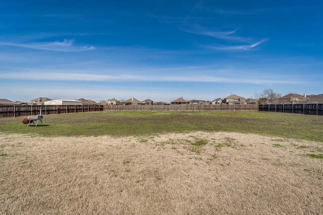 view of yard featuring a residential view and fence