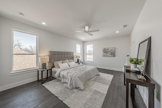 bedroom with baseboards, visible vents, and dark wood-style flooring