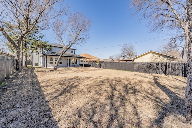 view of yard with a fenced backyard