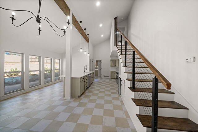 3829 Cloverdale Dr, Tyler, TX 75701 - stairs with high vaulted ceiling, a chandelier, and recessed lighting