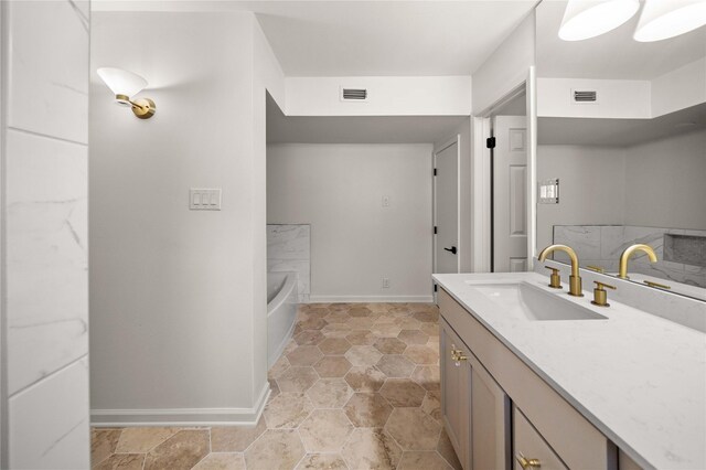 3829 Cloverdale Dr, Tyler, TX 75701 - full bathroom featuring a tub, vanity, and baseboards