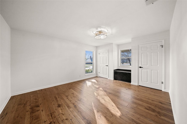 3829 Cloverdale Dr, Tyler, TX 75701 - unfurnished living room featuring hardwood / wood-style flooring and baseboards