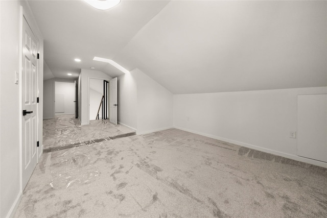 3829 Cloverdale Dr, Tyler, TX 75701 - additional living space with carpet, vaulted ceiling, and baseboards