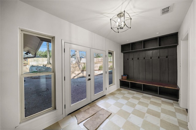 3829 Cloverdale Dr, Tyler, TX 75701 - mudroom with french doors, a chandelier, and light flooring