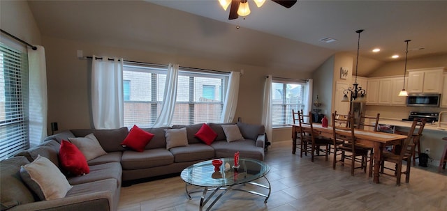 living area with a ceiling fan, recessed lighting, visible vents, and vaulted ceiling