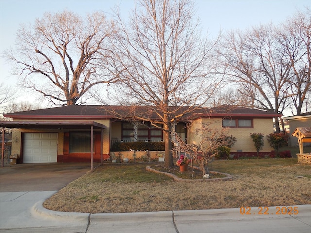 ranch-style house with a garage, a front yard, concrete driveway, and brick siding