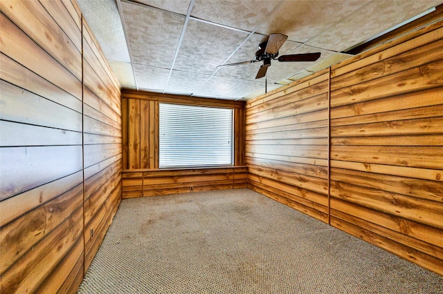 205 Bedford Ct E, Bedford, TX 76022 - carpeted spare room featuring wooden walls and a ceiling fan