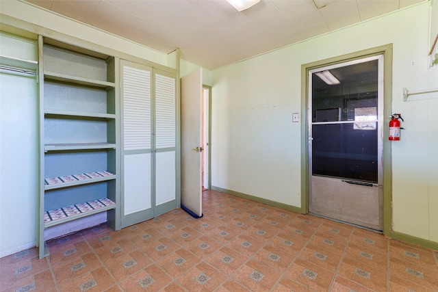 unfurnished bedroom with baseboards