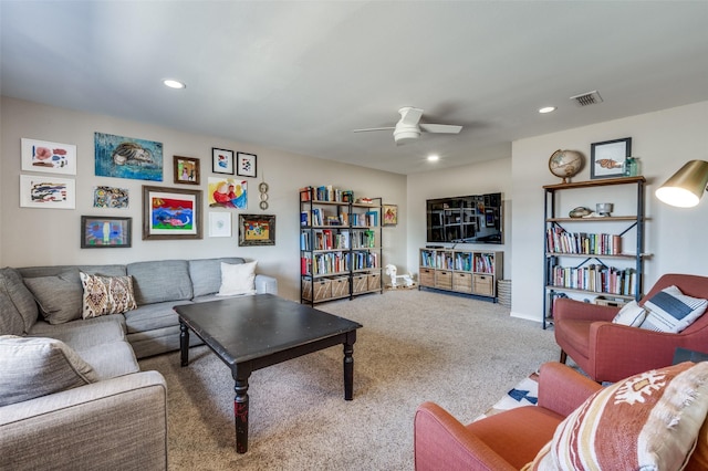 carpeted living room featuring visible vents, a ceiling fan, and recessed lighting