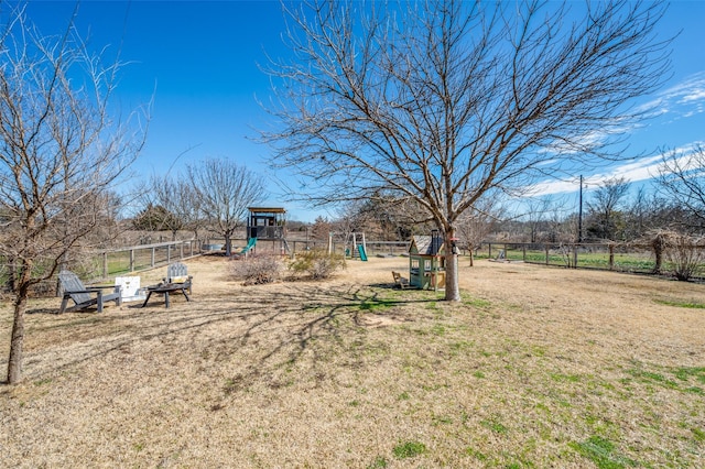 view of yard with fence and playground community