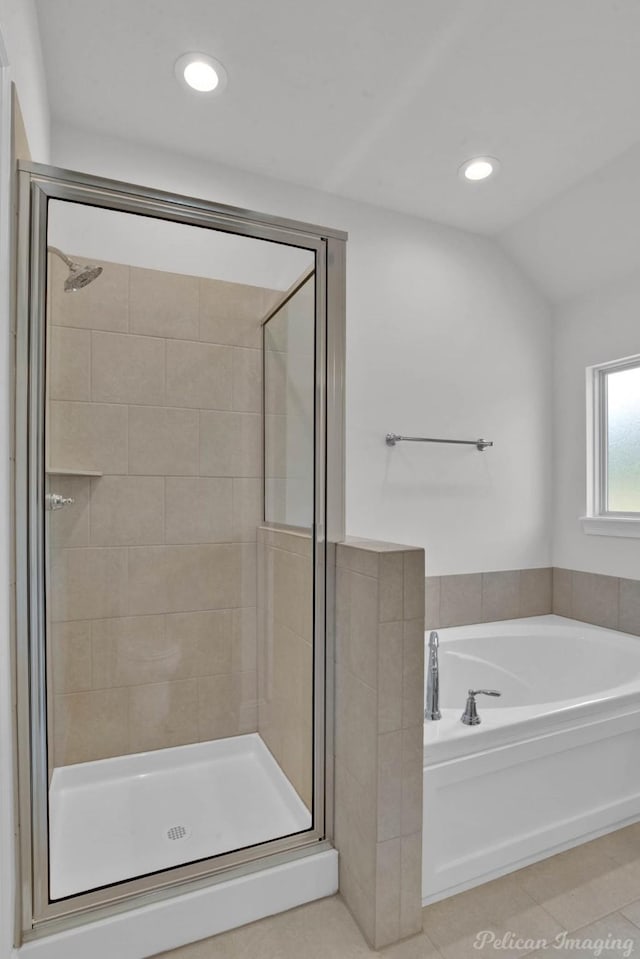 full bath with a garden tub, lofted ceiling, recessed lighting, a stall shower, and tile patterned flooring