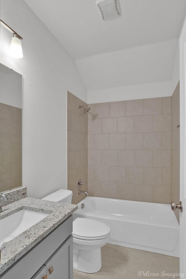 full bathroom featuring shower / bath combination, visible vents, toilet, vanity, and tile patterned flooring