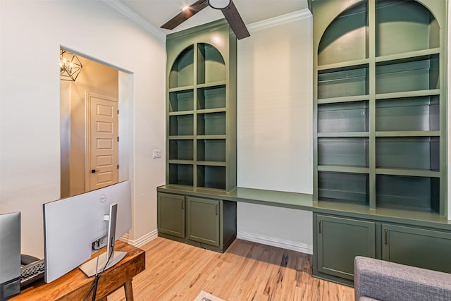 home office featuring light wood-style floors, baseboards, and crown molding