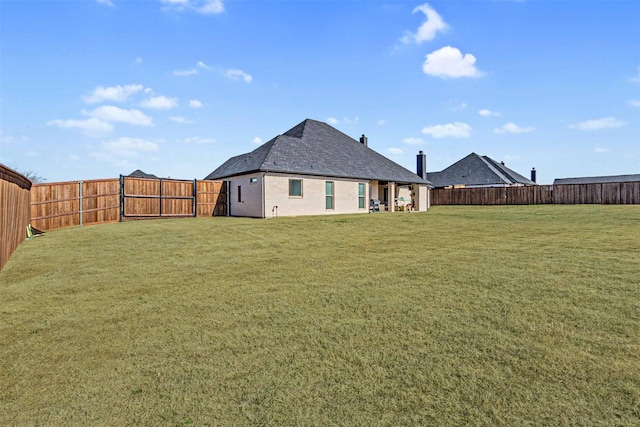 view of yard with a fenced backyard