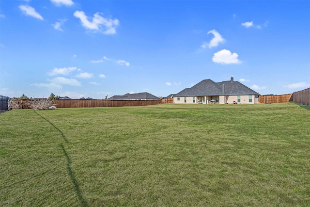 view of yard with a fenced backyard