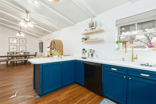 kitchen with blue cabinets, light countertops, dishwasher, and open shelves