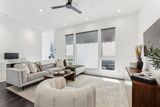 living area featuring a ceiling fan, wood finished floors, and recessed lighting