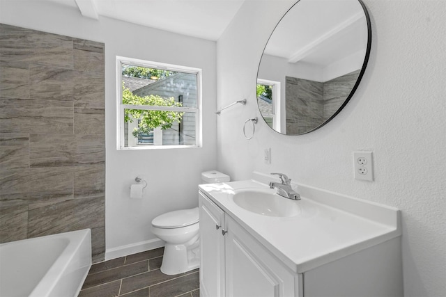 bathroom featuring wood finish floors, baseboards, vanity, and toilet