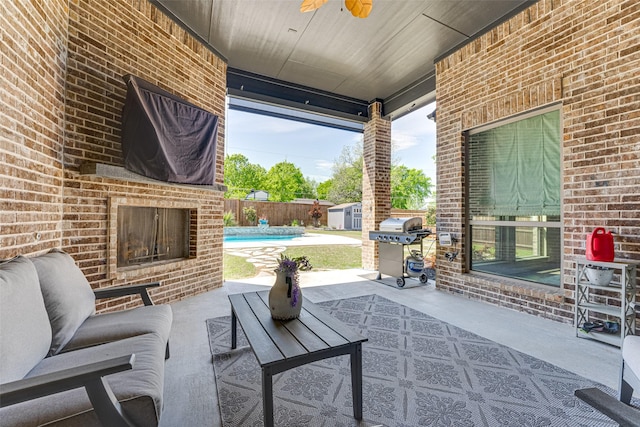 326 Prairie View Rd, Rockwall, TX 75087 - view of patio / terrace featuring grilling area, an outdoor living space with a fireplace, fence, a storage unit, and a fenced in pool