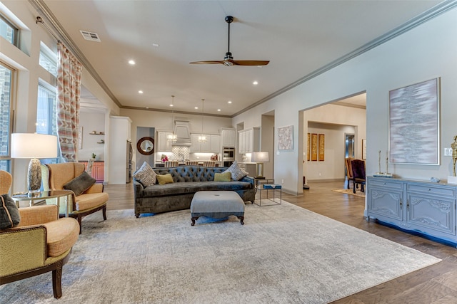 326 Prairie View Rd, Rockwall, TX 75087 - living room featuring ornamental molding, visible vents, light wood-style flooring, and a ceiling fan