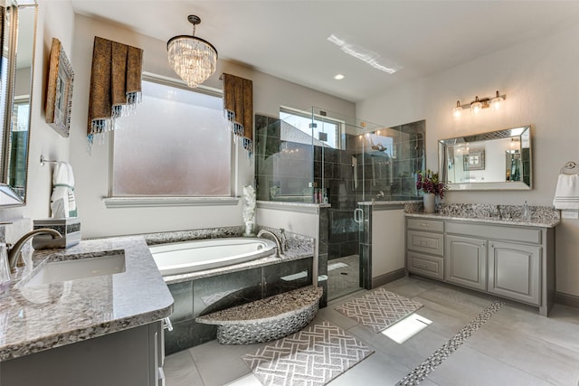326 Prairie View Rd, Rockwall, TX 75087 - full bath featuring two vanities, tile patterned flooring, a shower stall, a bath, and a sink