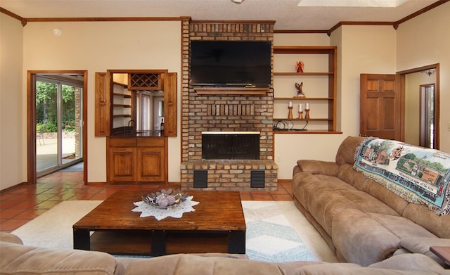 living area with light tile patterned floors, a textured ceiling, a brick fireplace, and crown molding