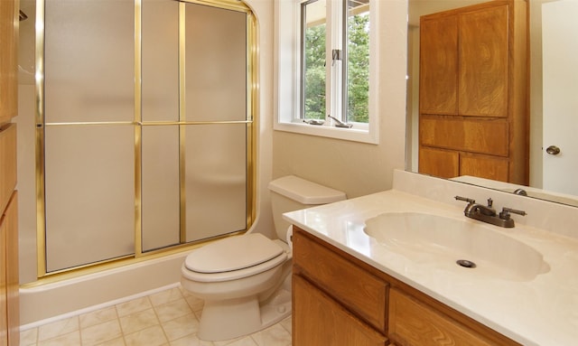 full bathroom featuring toilet, tile patterned flooring, and vanity