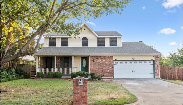 traditional-style home with a porch, a front lawn, an attached garage, and fence