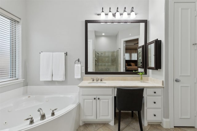 ensuite bathroom featuring a closet, ensuite bathroom, a stall shower, vanity, and a tub with jets