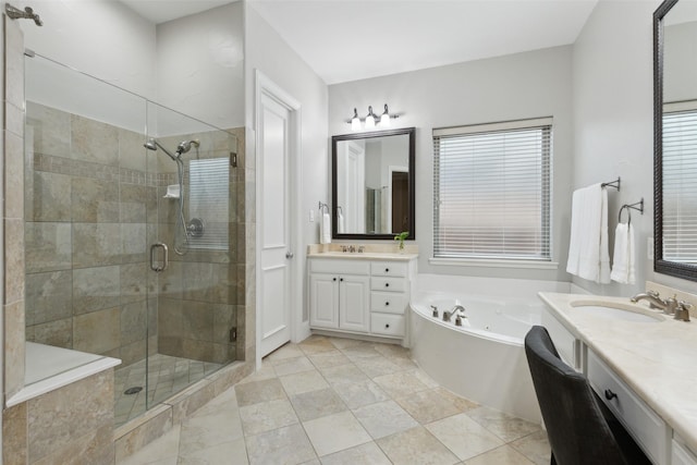 full bathroom with a garden tub, a shower stall, and vanity