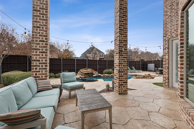 view of patio with a fenced in pool, a fenced backyard, and an outdoor living space