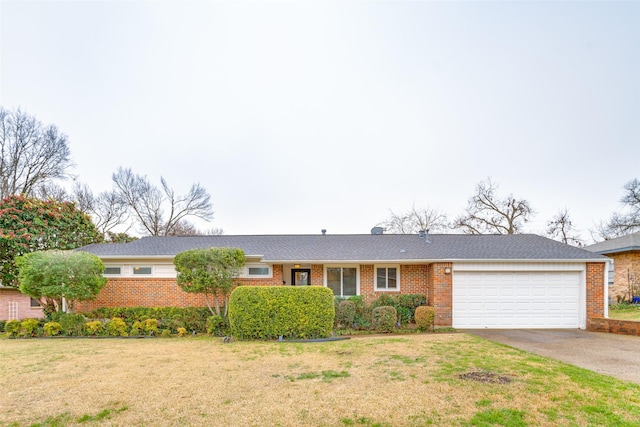 ranch-style home with aphalt driveway, a garage, brick siding, and a front lawn