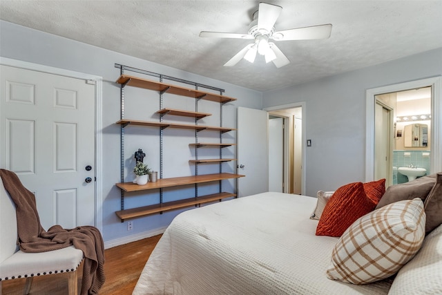 430 Mayrant Dr, Dallas, TX 75224 - bedroom with wood finished floors, baseboards, and ensuite bathroom