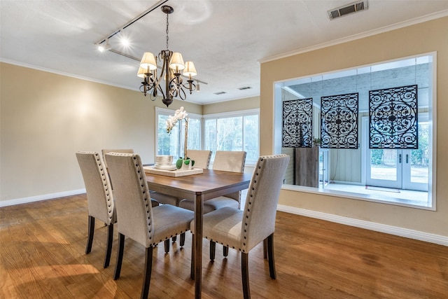430 Mayrant Dr, Dallas, TX 75224 - dining room featuring a chandelier, baseboards, track lighting, and ornamental molding