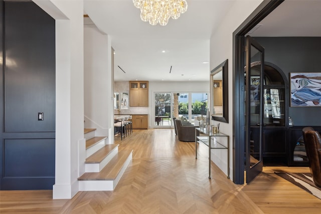 entrance foyer with a notable chandelier and stairway