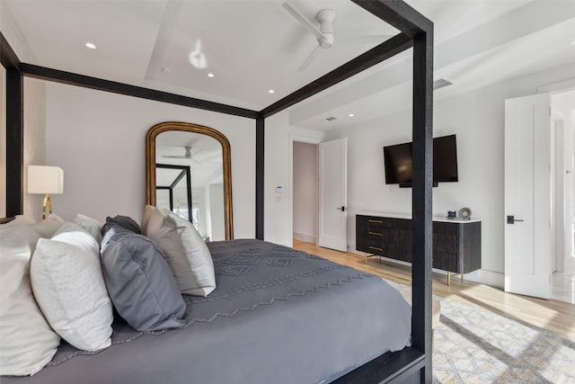 bedroom featuring light wood finished floors, beamed ceiling, visible vents, and recessed lighting