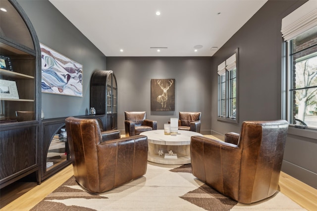 living area featuring recessed lighting and light wood-style flooring