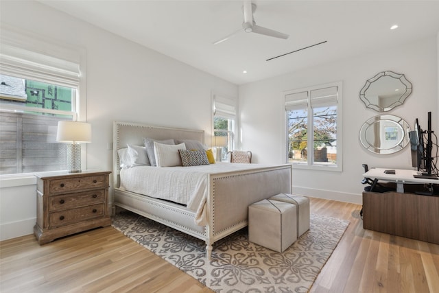 bedroom with light wood-type flooring, ceiling fan, baseboards, and recessed lighting