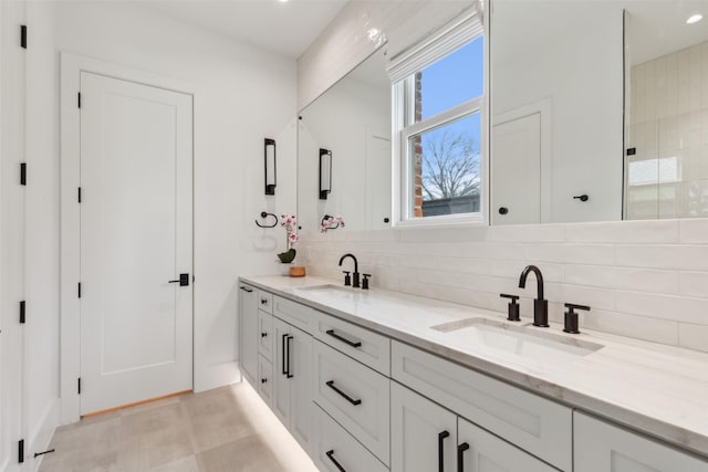 full bathroom with double vanity, a sink, and decorative backsplash