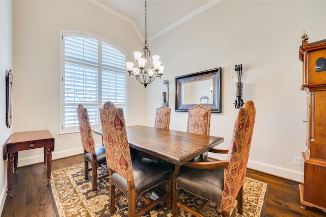 dining area with baseboards, a chandelier, dark wood finished floors, and ornamental molding