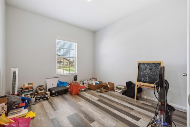 recreation room with wood finished floors