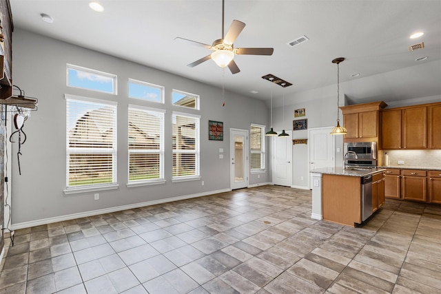 kitchen featuring stainless steel appliances, visible vents, brown cabinets, ceiling fan, and light tile patterned floors
