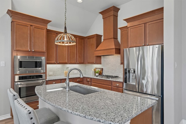 813 Louisville Rd, Aubrey, TX 76227 - kitchen with stainless steel appliances, a sink, custom exhaust hood, backsplash, and vaulted ceiling