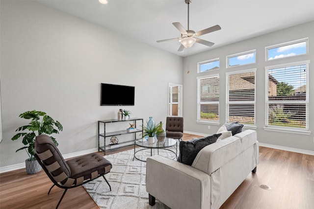 813 Louisville Rd, Aubrey, TX 76227 - living area featuring baseboards, wood finished floors, and ceiling fan