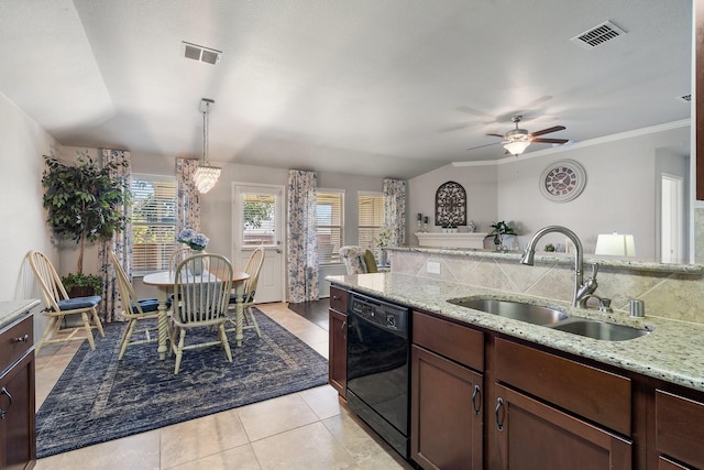 kitchen featuring dishwasher, light stone counters, a sink, and visible vents