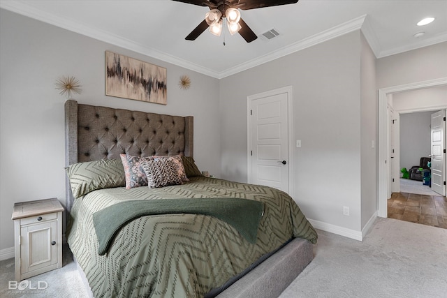 bedroom featuring light carpet, visible vents, baseboards, ceiling fan, and crown molding