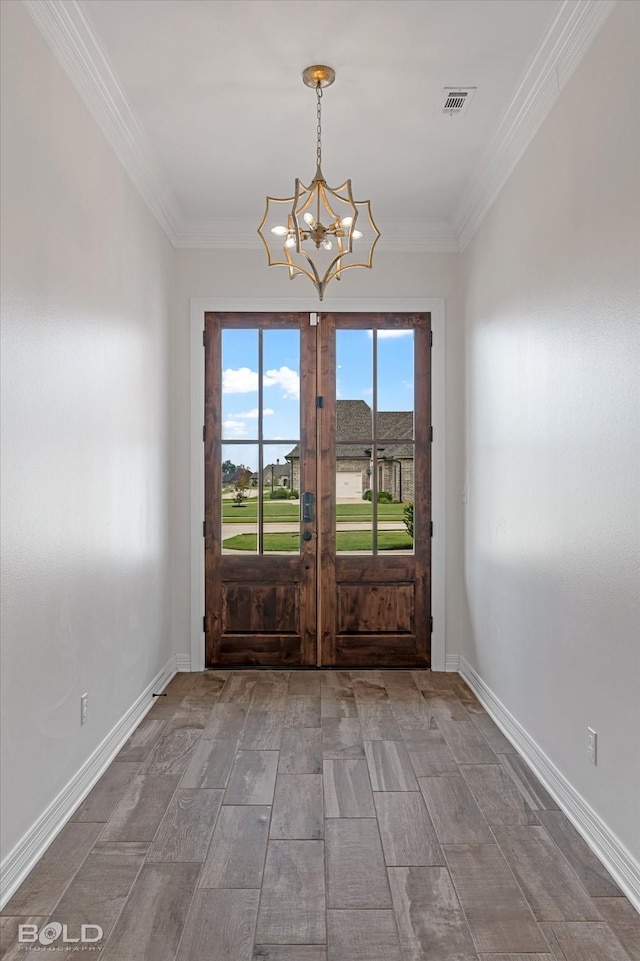 doorway with baseboards, ornamental molding, a notable chandelier, and french doors