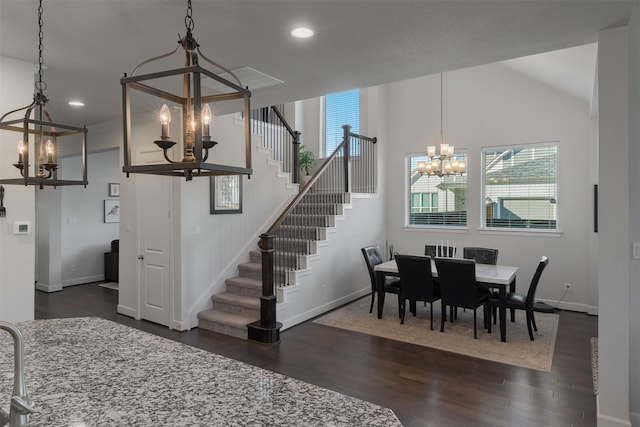 dining area with a chandelier, recessed lighting, dark wood-style flooring, baseboards, and stairs